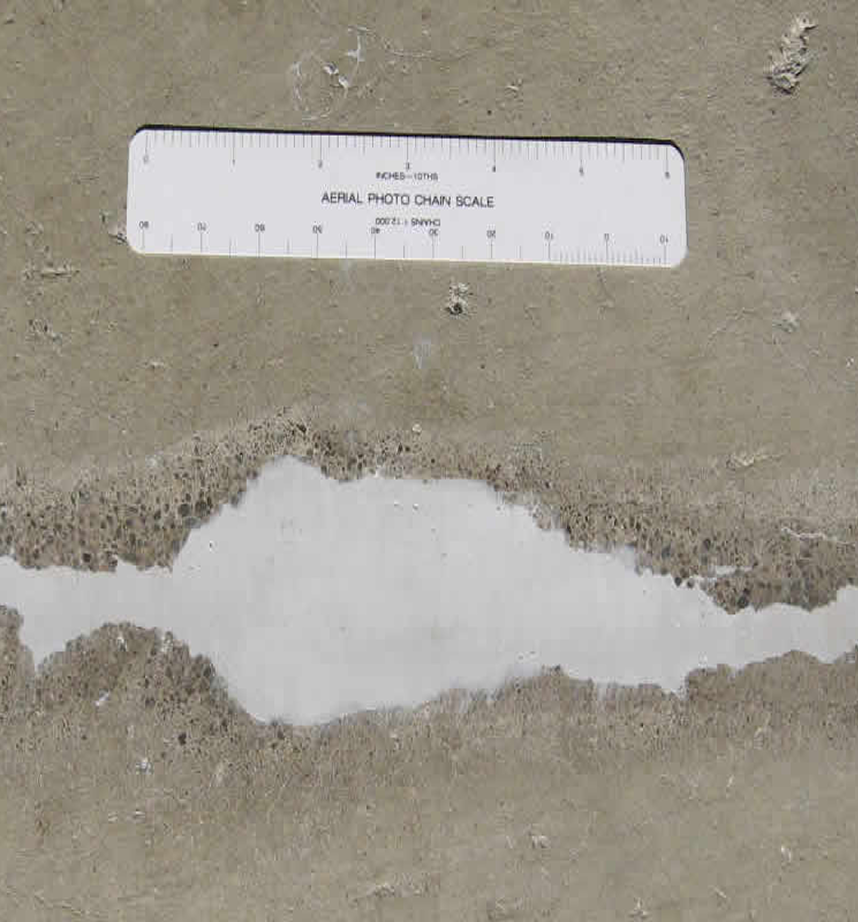 Images showing the measurement and repair of cracks in concrete.