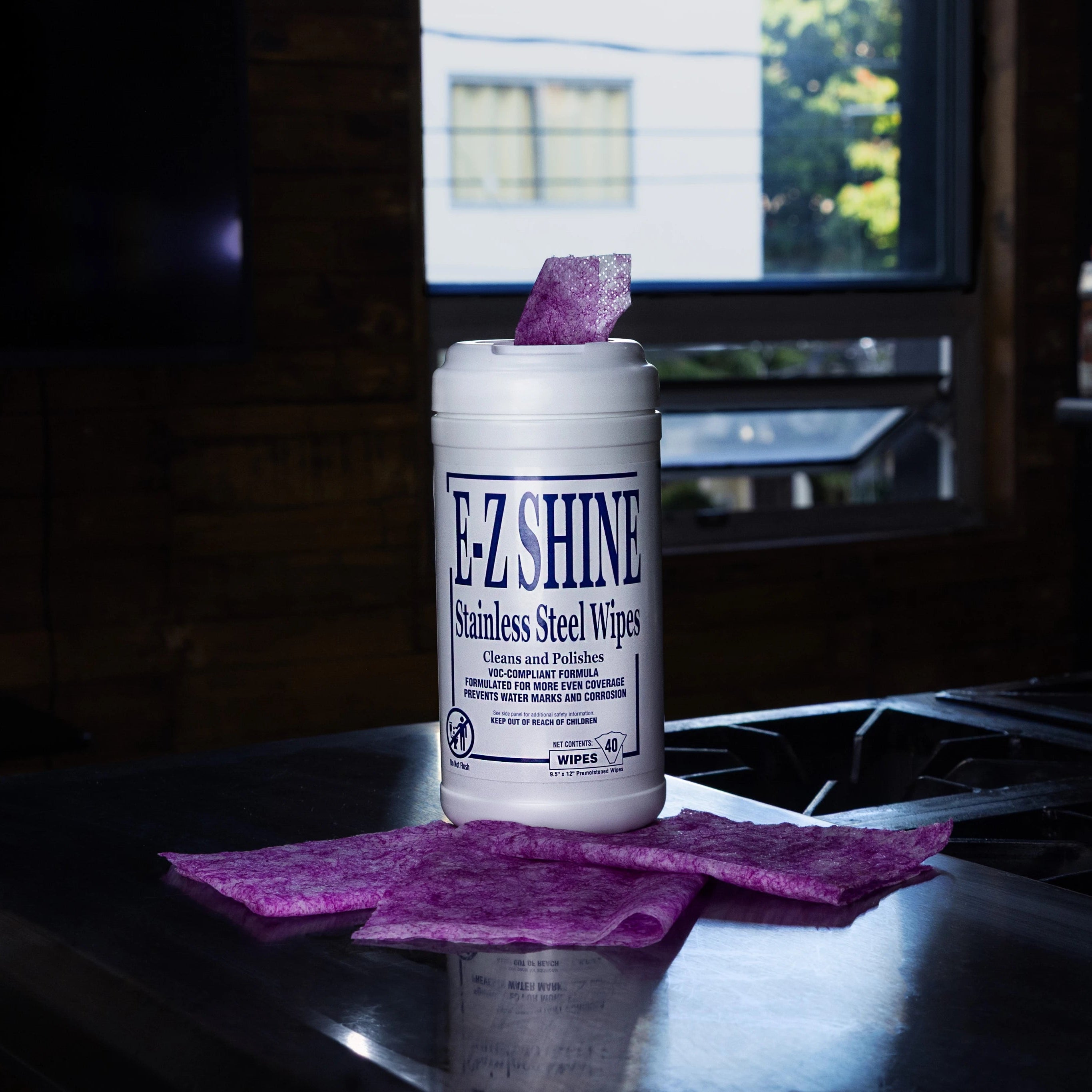 E-Z Shine stainless steel wipes on a kitchen counter with a blurred background